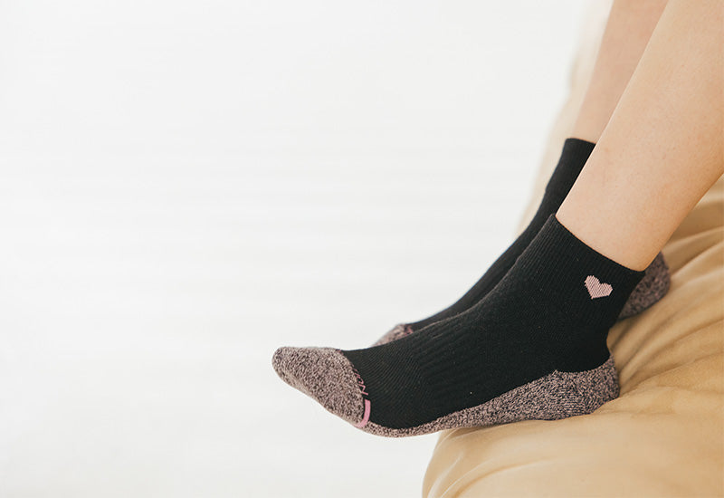 Person sleeping comfortably in cozy socks — compression socks at night pros and cons — Dr. Motion blog cover