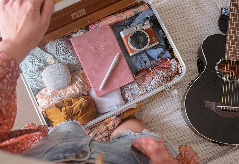 Holiday packing checklist with travel essentials — Dr. Motion blog cover