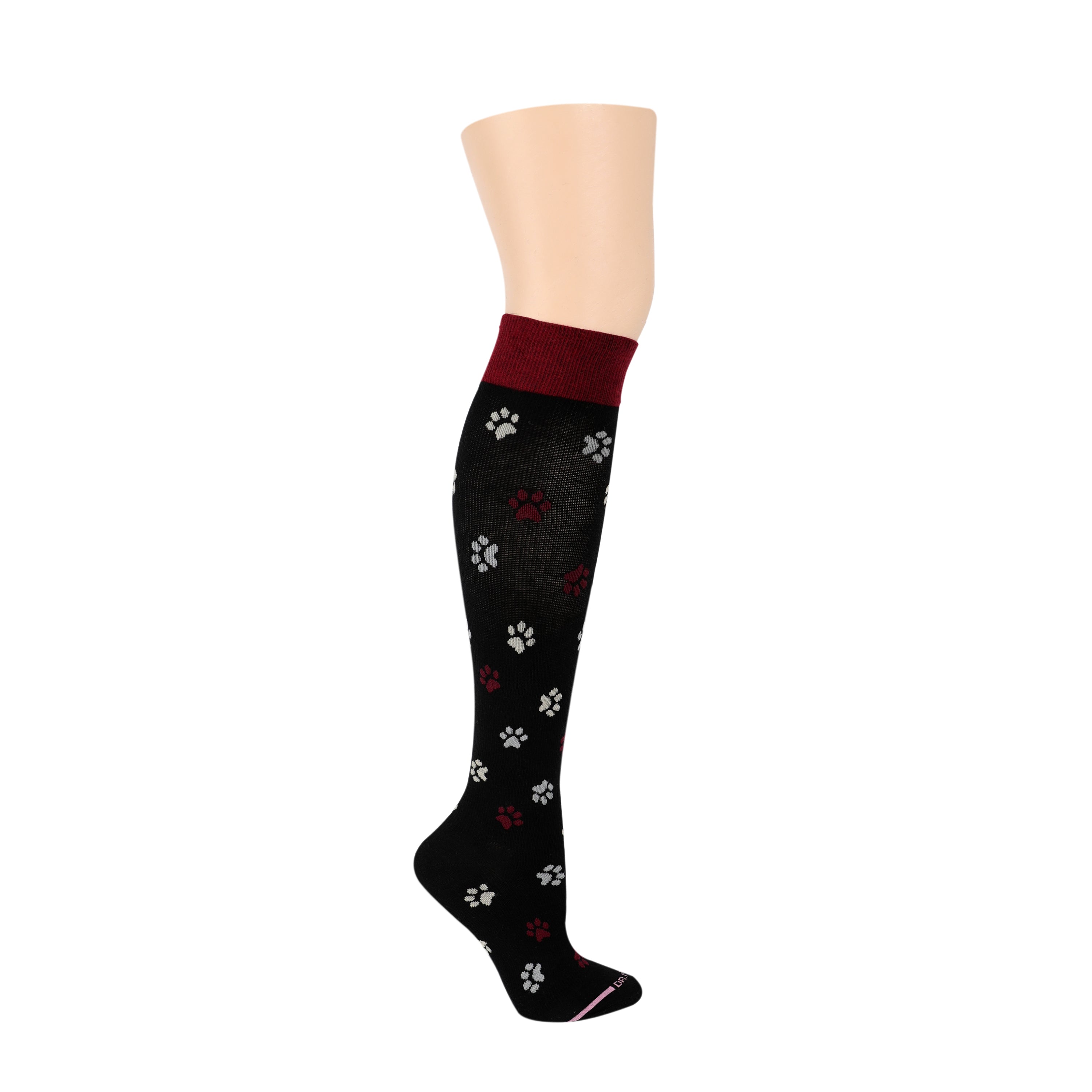 Knee-high black compression socks with red and white paw print patterns.