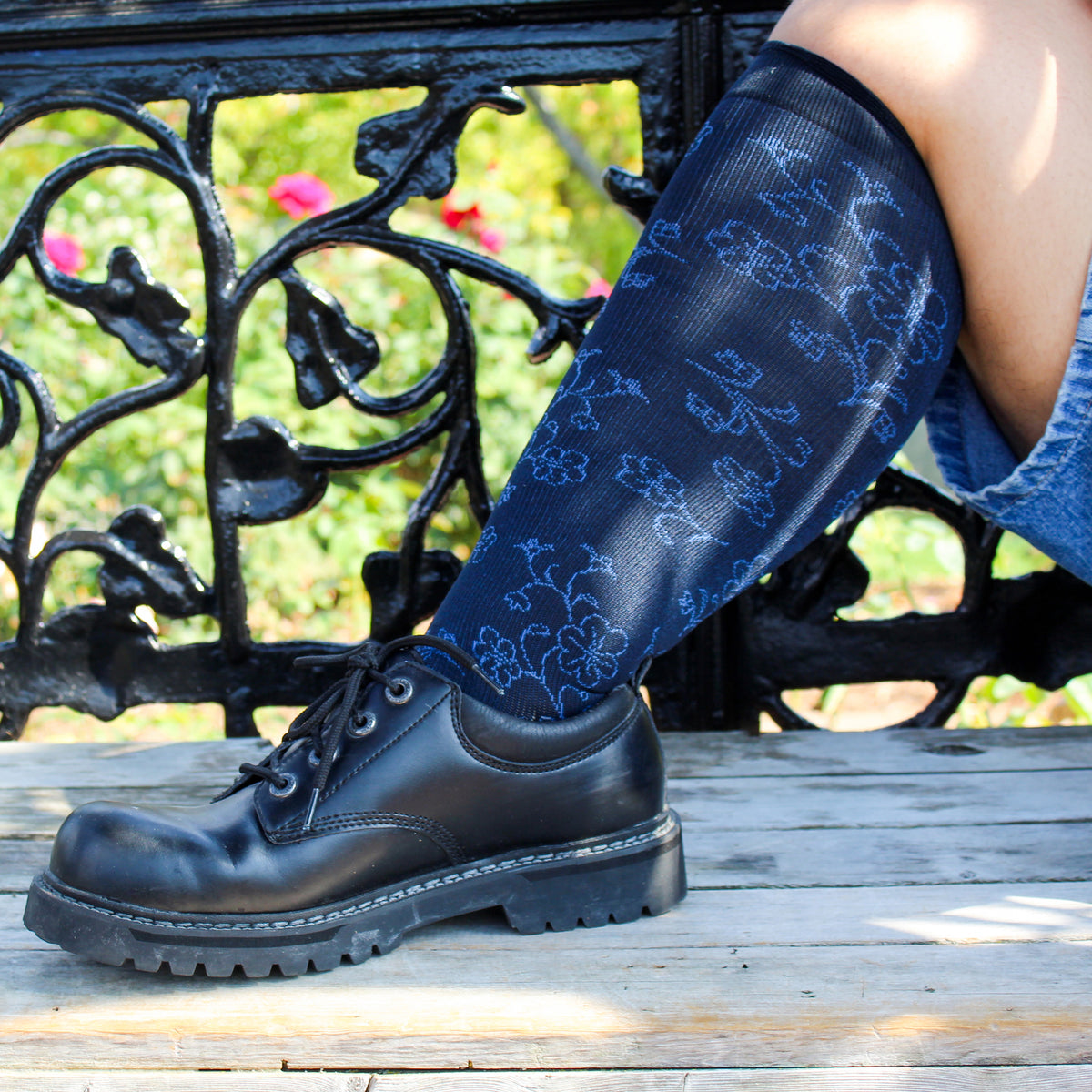 Navy wide-calf knee-high compression socks worn in an everyday setting