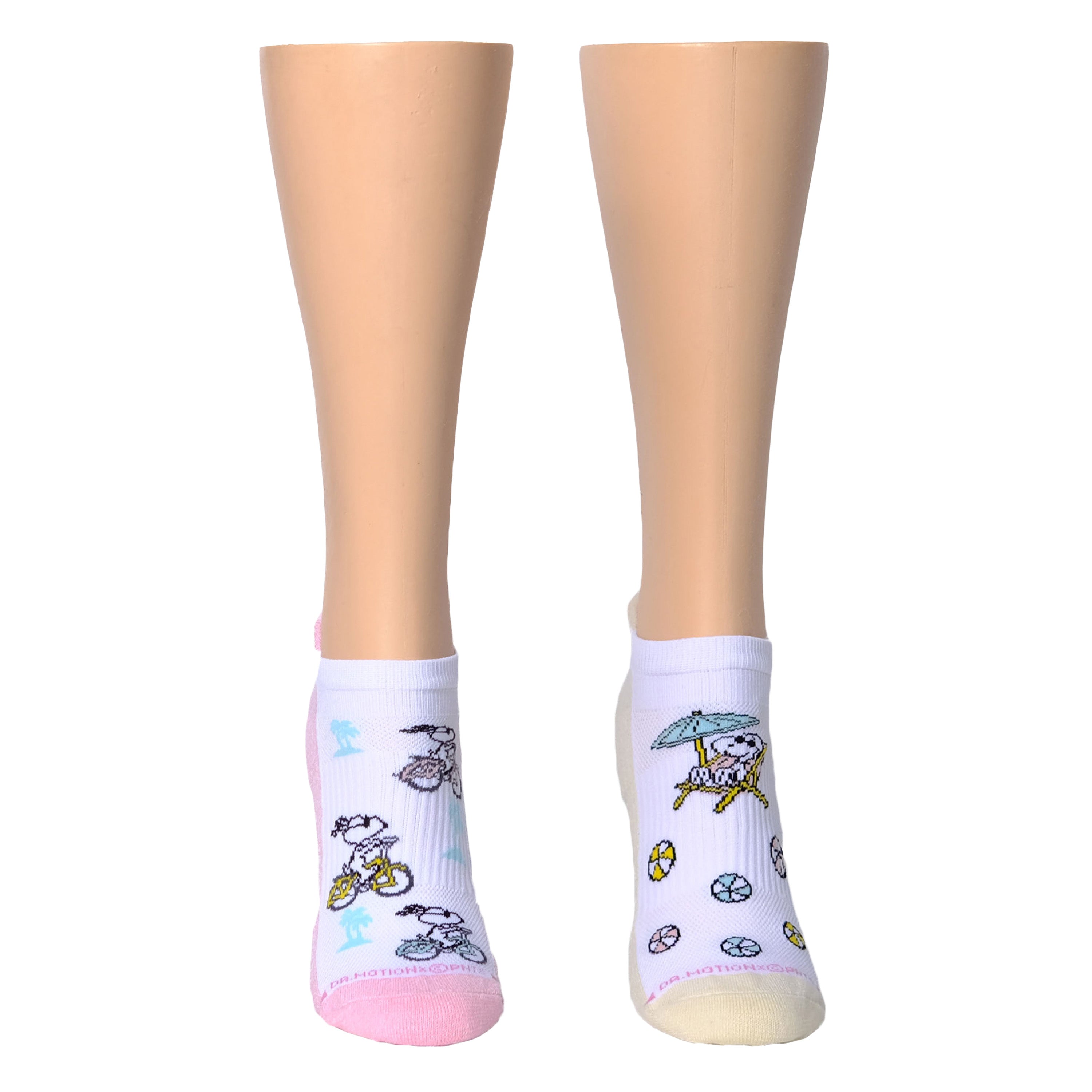 Ankle compression socks featuring Snoopy designs with beach themes, displayed on mannequin legs.