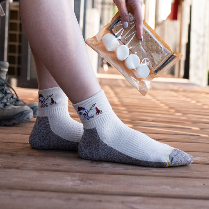 Ivory oat marl outdoor compression quarter socks worn in a lifestyle setting