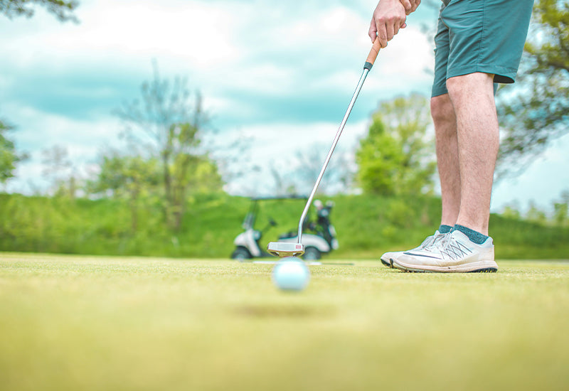Golfer with compression socks in the golf bag — Dr. Motion blog cover
