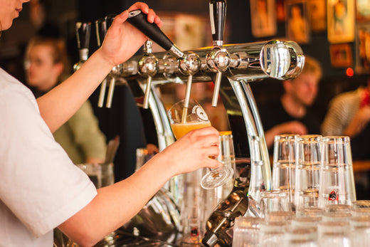 Bartender working a long shift while wearing compression socks