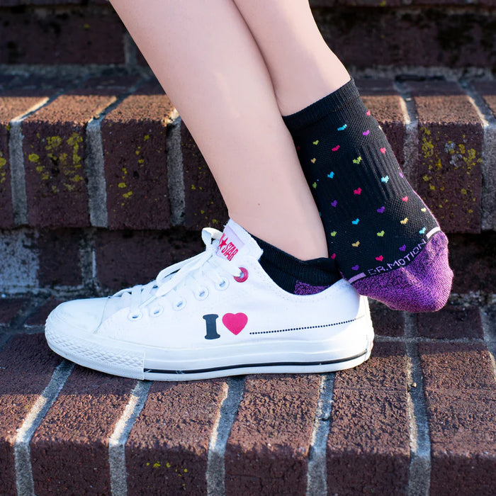 Black compression ankle socks worn in a lifestyle setting