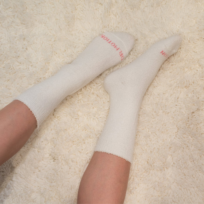 White diabetic cozy comfort crew socks worn in a lifestyle setting
