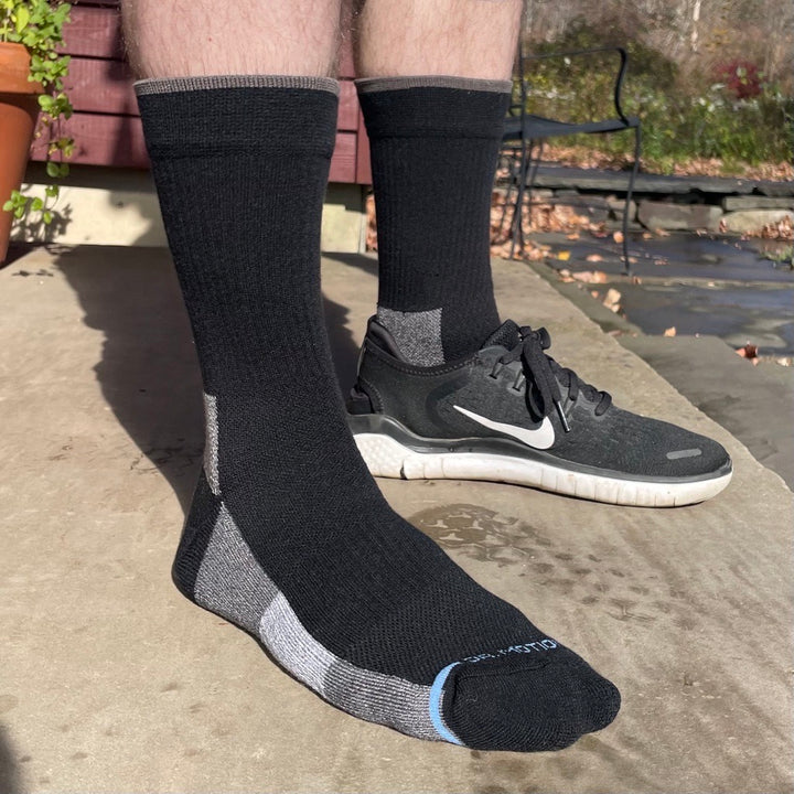 Black outdoor compression socks on a day hike