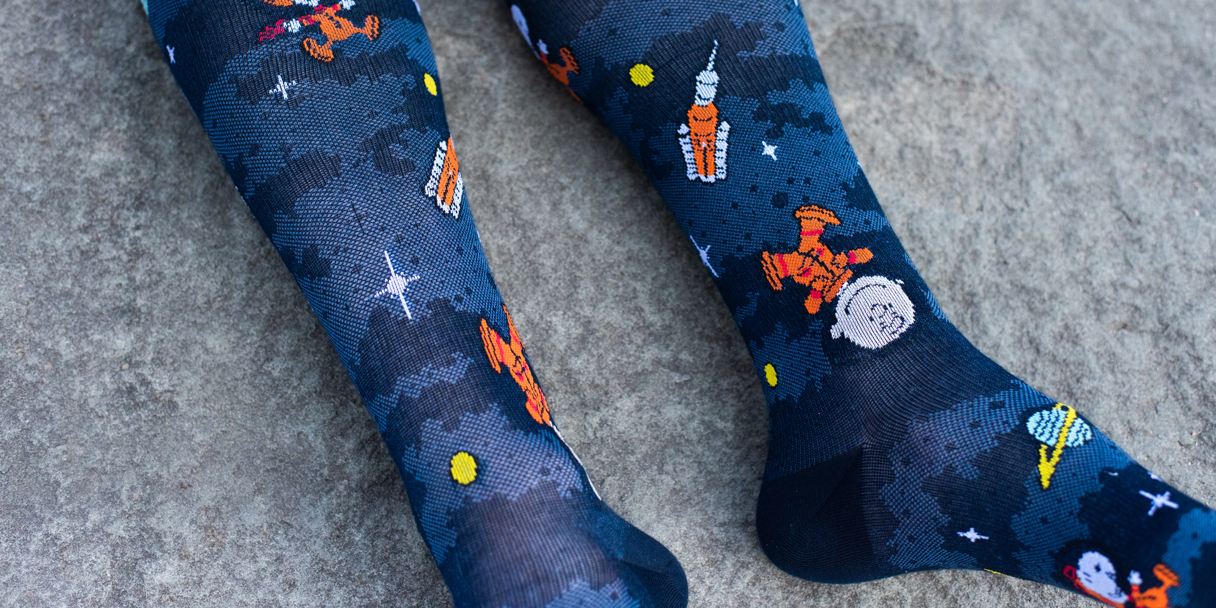 Men's Dr. Motion x Peanuts compression socks collection — Snoopy and Charlie Brown designs.