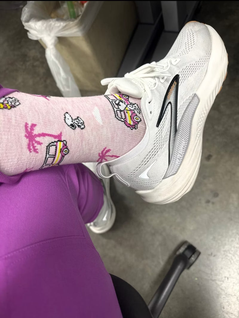 Astronaut Snoopy crew socks on a rock